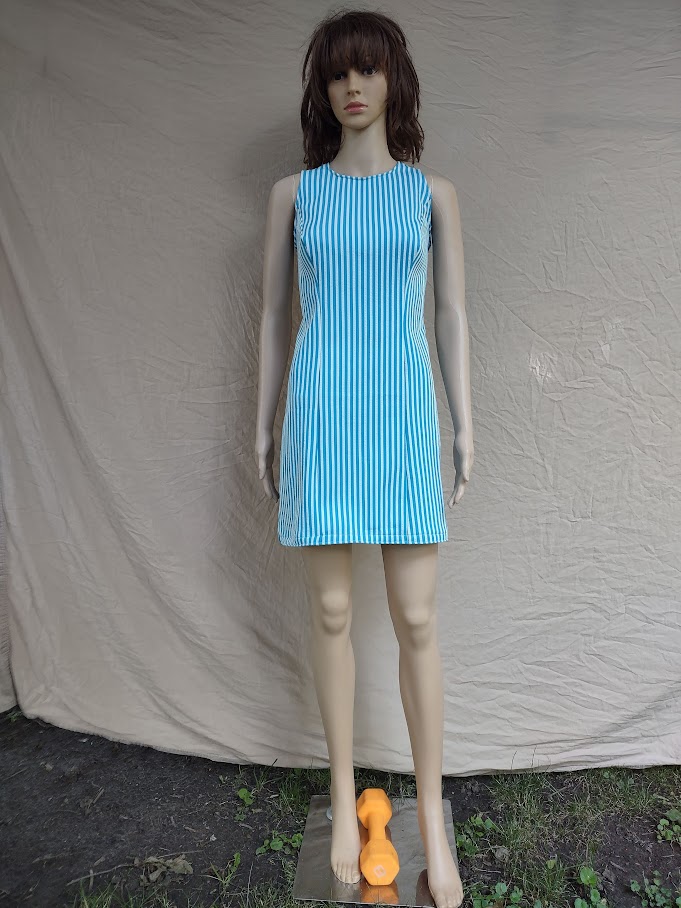 A mannequin wearing a blue and white striped dress
