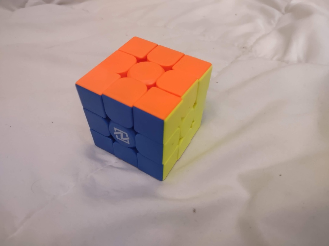 a speed cube, which looks different from a normal rubiks cube becasue it has rounded corners on the inside of the tiles.